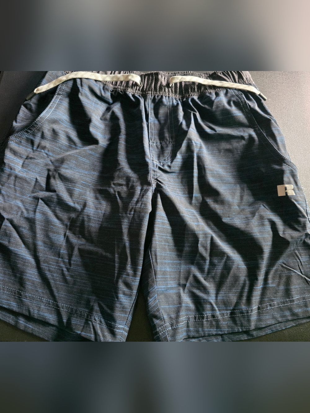 Gently Used Mens size Medium Russell Althetics swim trunks in blue and black